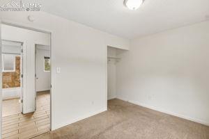 Image 10 of 26: 2nd view of master bedroom