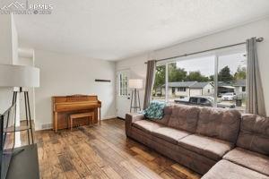 Image 2 of 26: Entry into bright and open living room