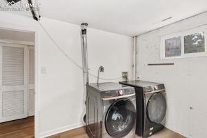 Image 23 of 26: Large laundry room located in basement
