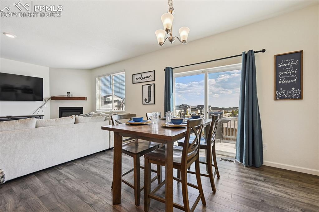 Image 10 of 32: Dining area with plenty of natural light, walks out to patio and backyard.