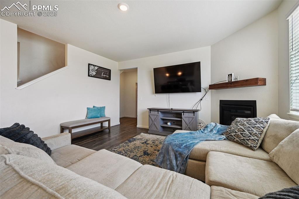 Image 12 of 32: Living room featuring electric fireplace and recessed lighting