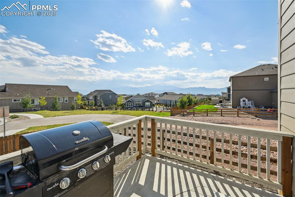 Image 2 of 32: Balcony with a Mountain view and area for grilling.