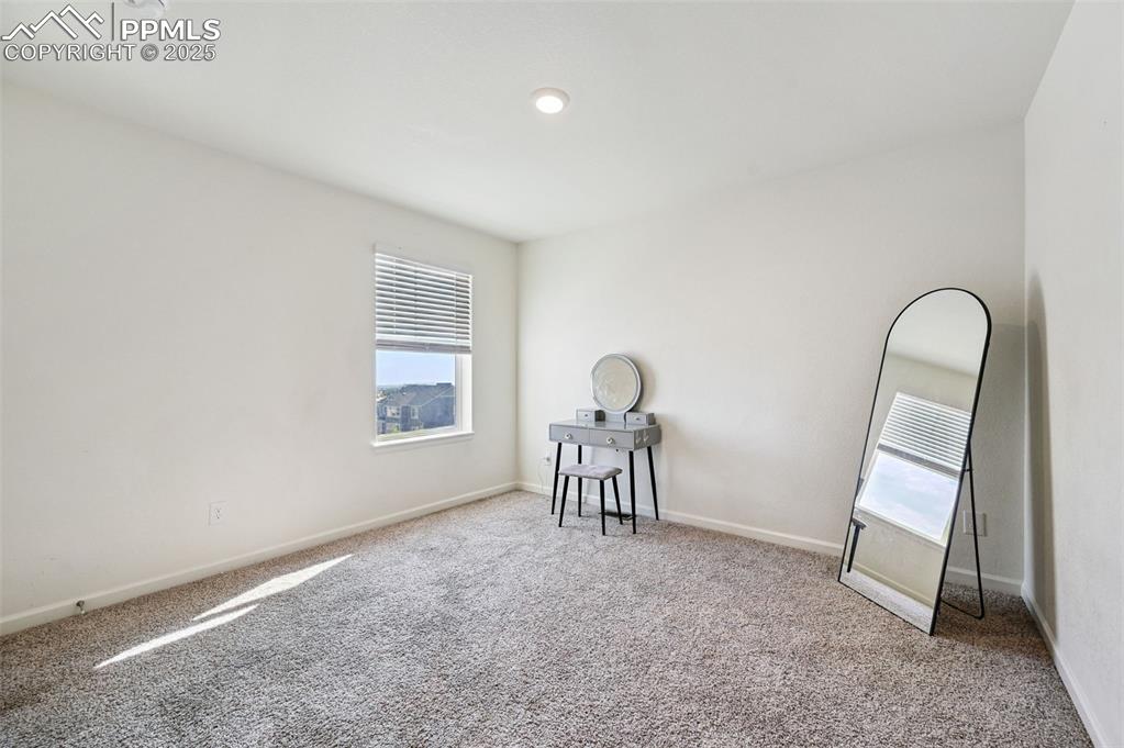 Image 28 of 32: Spare room with carpet floors and recessed lighting