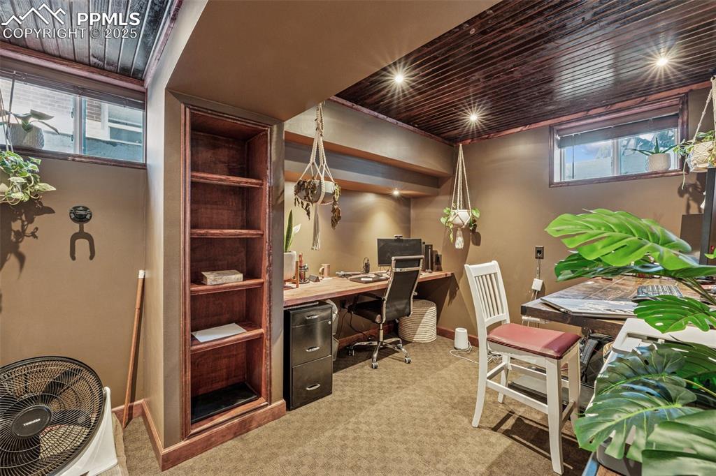 Image 23 of 30: Home office featuring light carpet