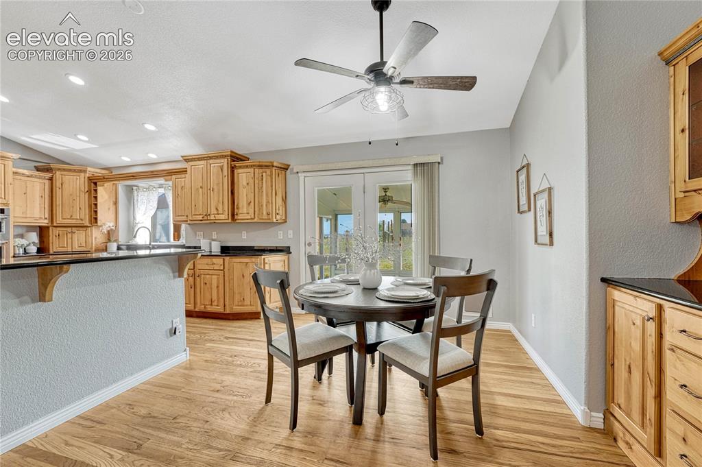 Image 12 of 39: Dining space with walk-out to...