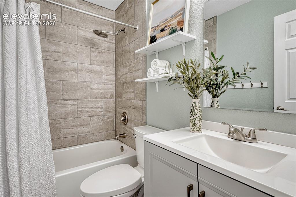 Image 23 of 39: Full bathroom on main level.