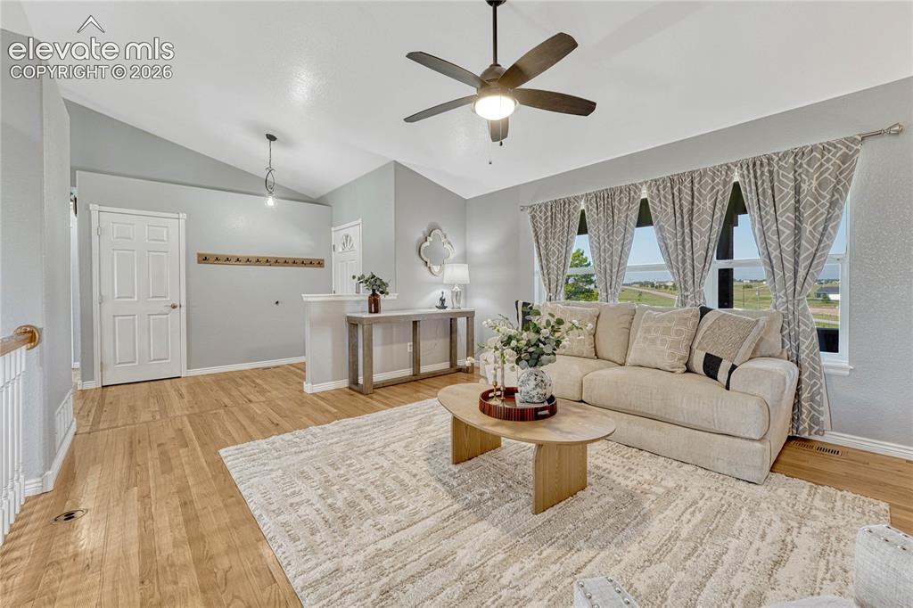 Image 5 of 39: ...to oak flooring, vaulted ceilings and Pikes Peak views from the living r