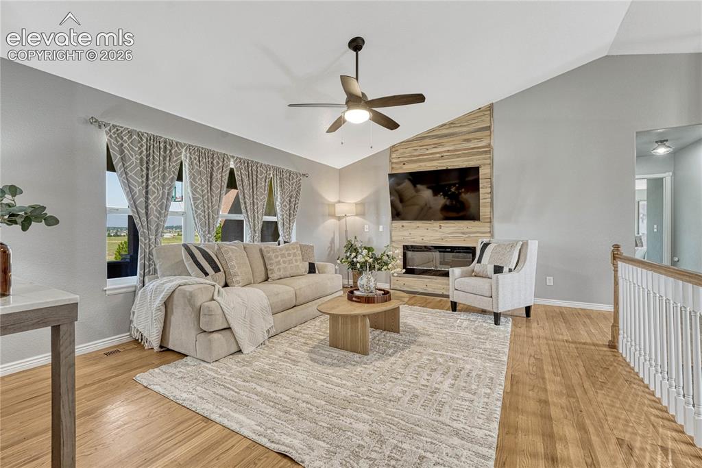 Image 6 of 39: Vaulted ceiling, oak floors...