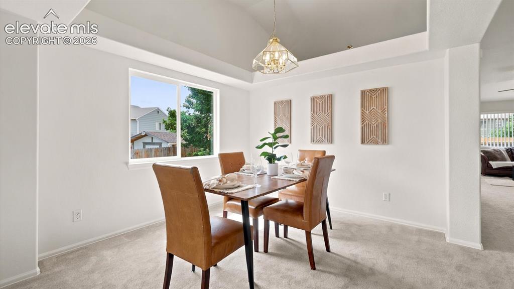 Image 10 of 46: View of the Dining Area, Entry, and Living Room.