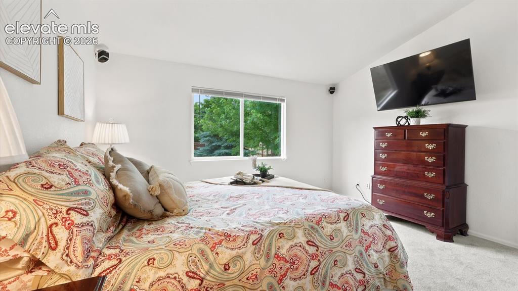 Image 31 of 46: Appliances include a smoothtop range oven, microwave oven, dishwasher, and 