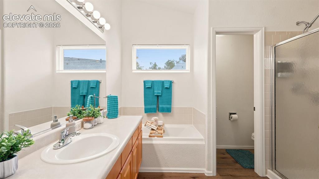 Image 33 of 46: The private Primary Suite includes plush carpeting, surround sound speakers