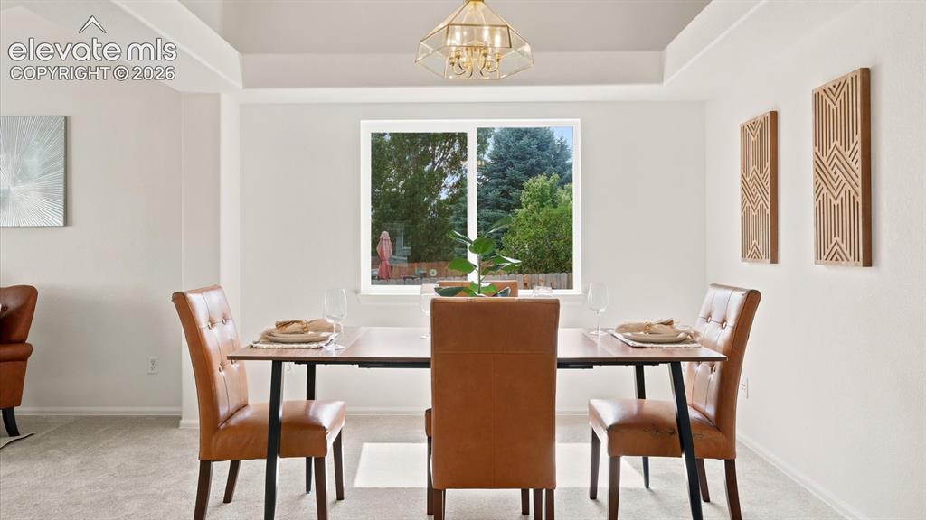 Image 9 of 46: The Living Room flows seamlessly into the formal Dining Area.