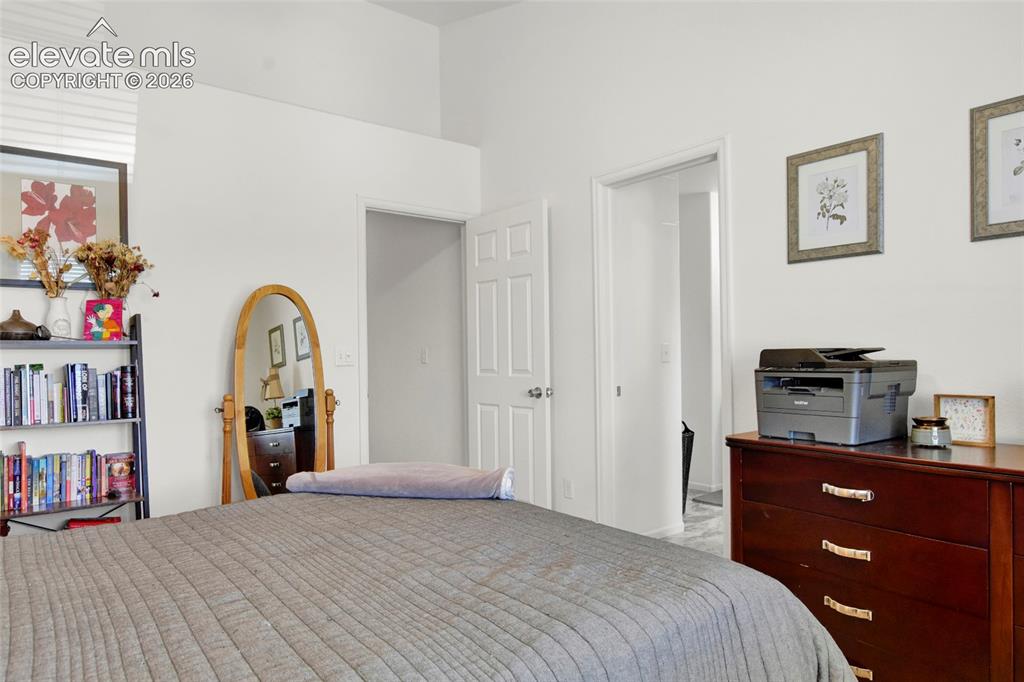 Image 11 of 22: Primary Bedroom with vaulted ceilings