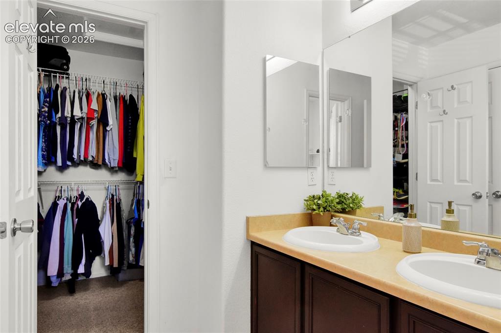 Image 14 of 22: Primary bathroom and walk in closet