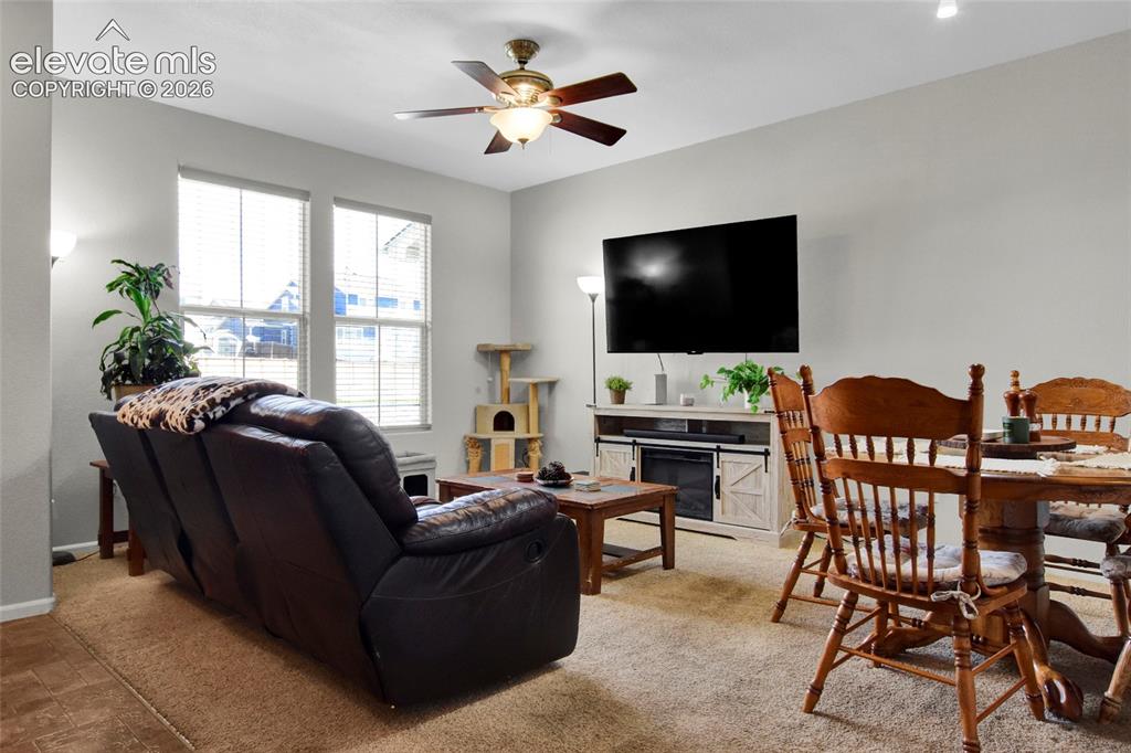 Image 2 of 22: Living room with tall ceilings and lots of light