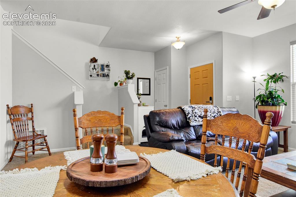 Image 6 of 22: Dining area and living room