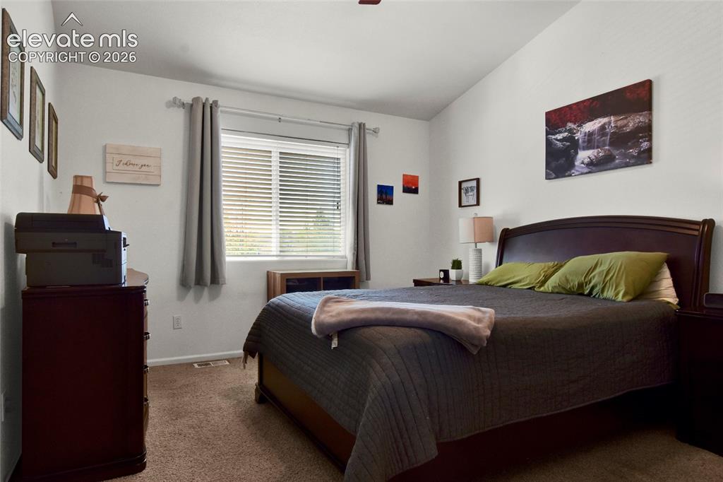 Image 9 of 22: Primary Bedroom with vaulted ceilings