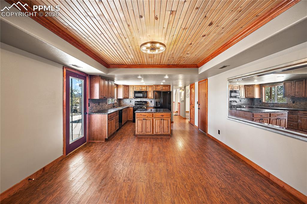 Image 13 of 40: Kitchen is open to large dining space or even a family/rec space.