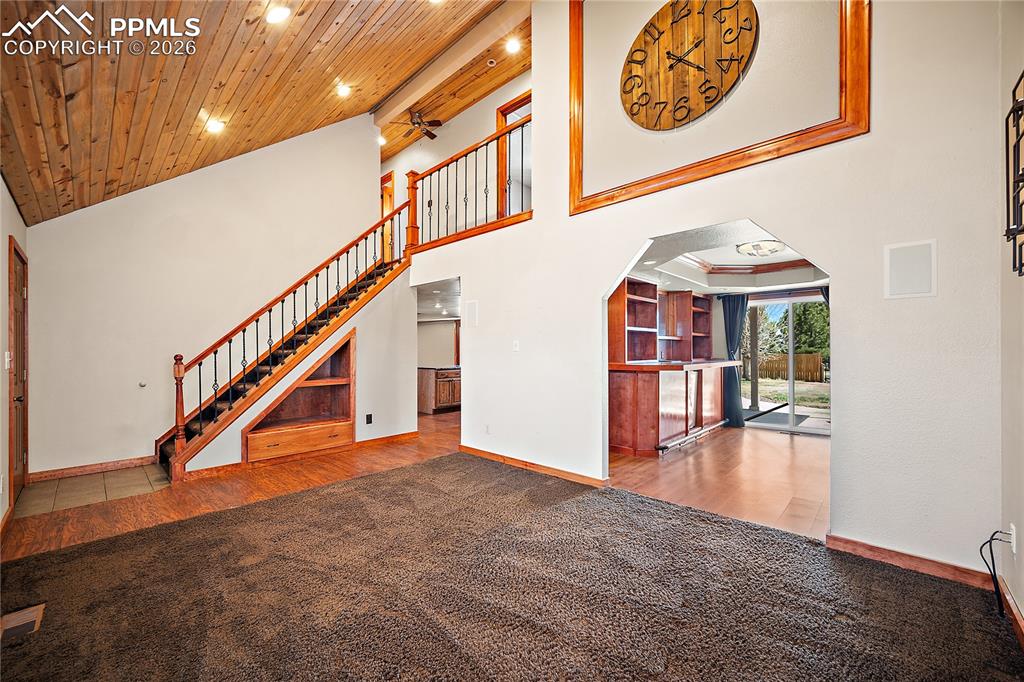 Image 5 of 40: Open to the dining/den/bar space that walks out to back yard and patio.