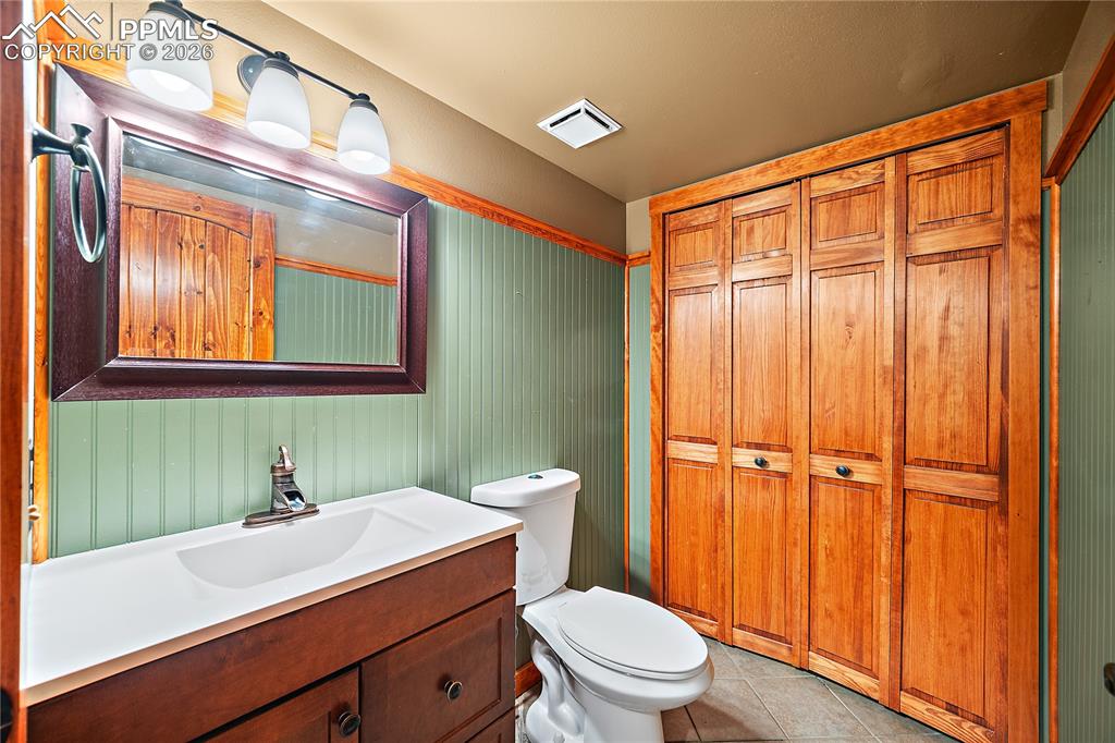 Image 9 of 40: Main level 1/2 bath.