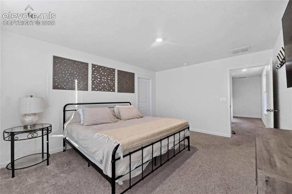 Image 9 of 22: Carpeted interior room with recessed lighting and a ceiling vent
