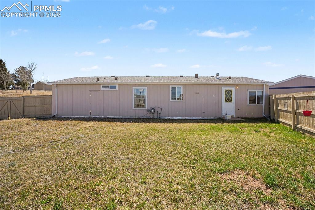 Image 20 of 27: Huge fenced yard, attracting beautiful hummingbirds throughout the season