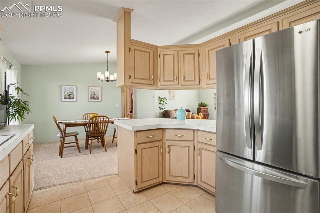 Image 9 of 27: Welcoming space for everyday meals or casual gatherings, with a warm, funct