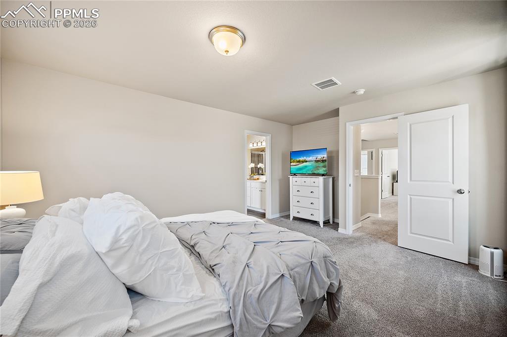 Image 21 of 50: Master Bedroom