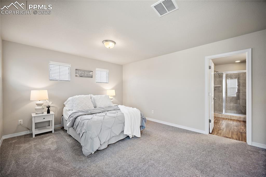 Image 22 of 50: Master Bedroom