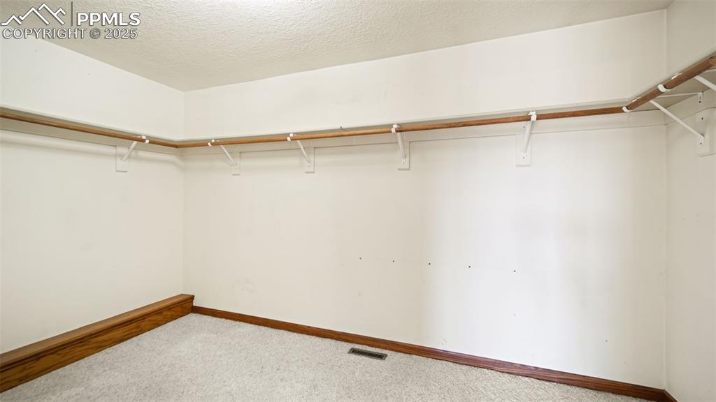 Image 18 of 36: Master bedroom closet 