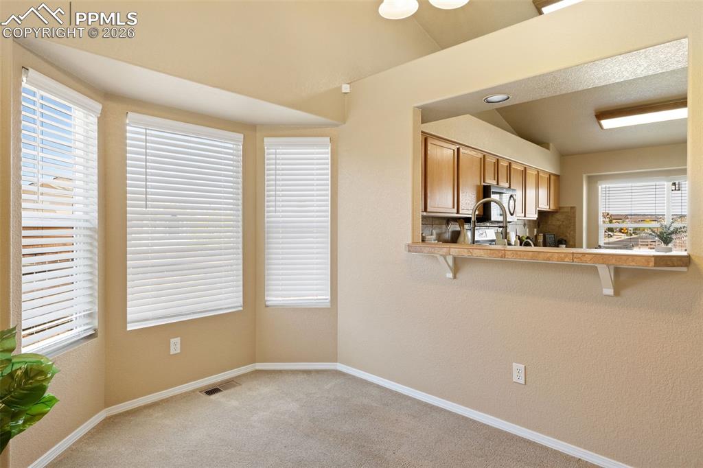 Image 12 of 44: Dining area with ample natural light.