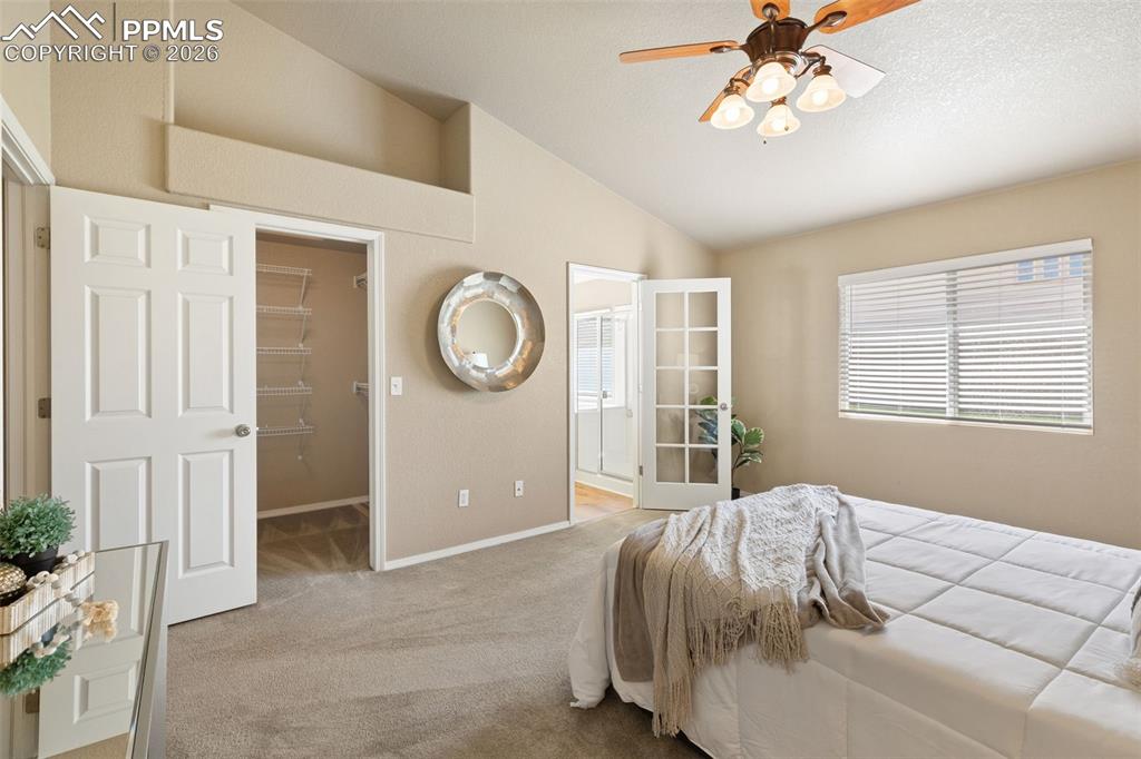 Image 19 of 44: Primary bedroom with walk-in closet.