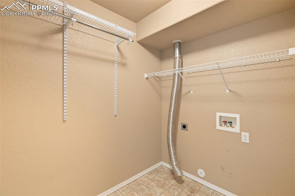 Image 34 of 44: Laundry room in basement.