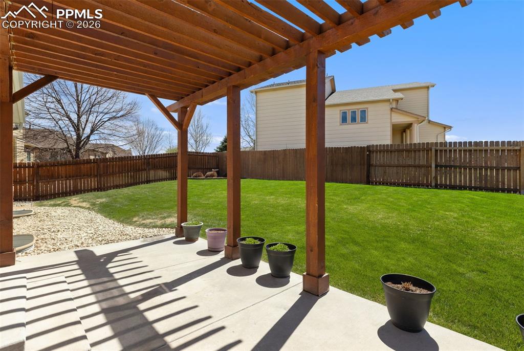 Image 35 of 44: Patio with beautiful pergola.