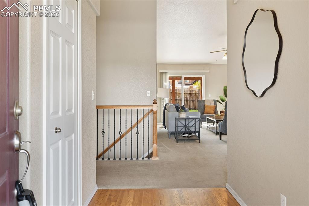 Image 5 of 44: Entry with view into living room.