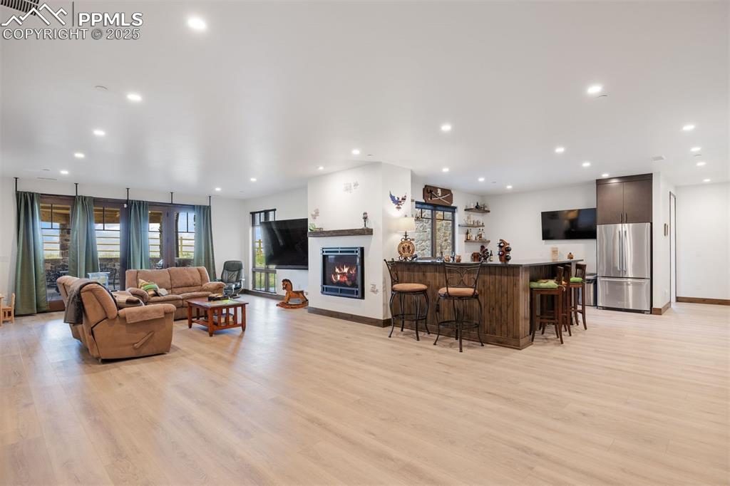 Image 21 of 36: Spacious recreation room with a flexible layout for lounging, game tables, 