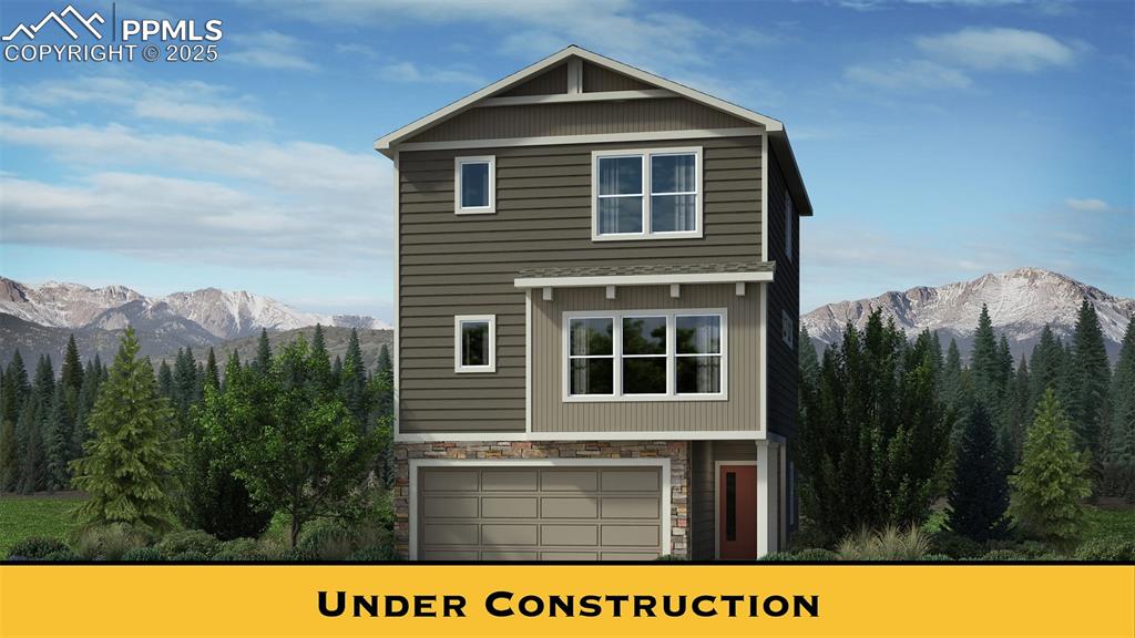 Caption: View of front of property featuring a mountain view, stone siding, a view of trees, and a garage