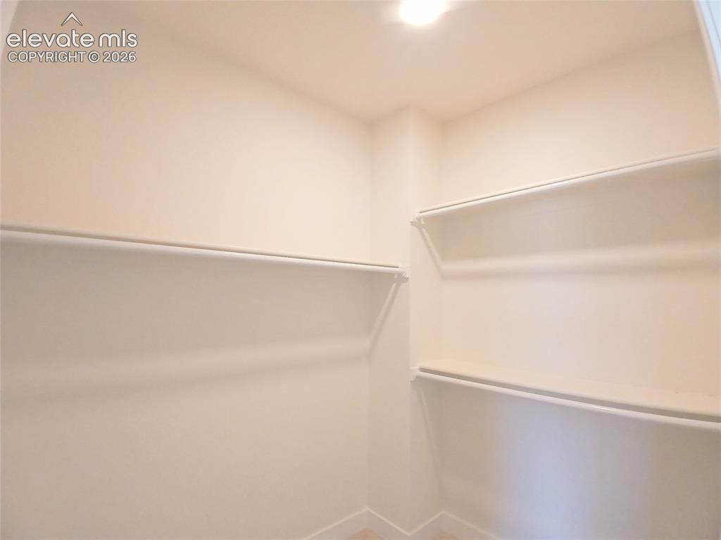 Image 16 of 33: En Suite Walk-in Closet