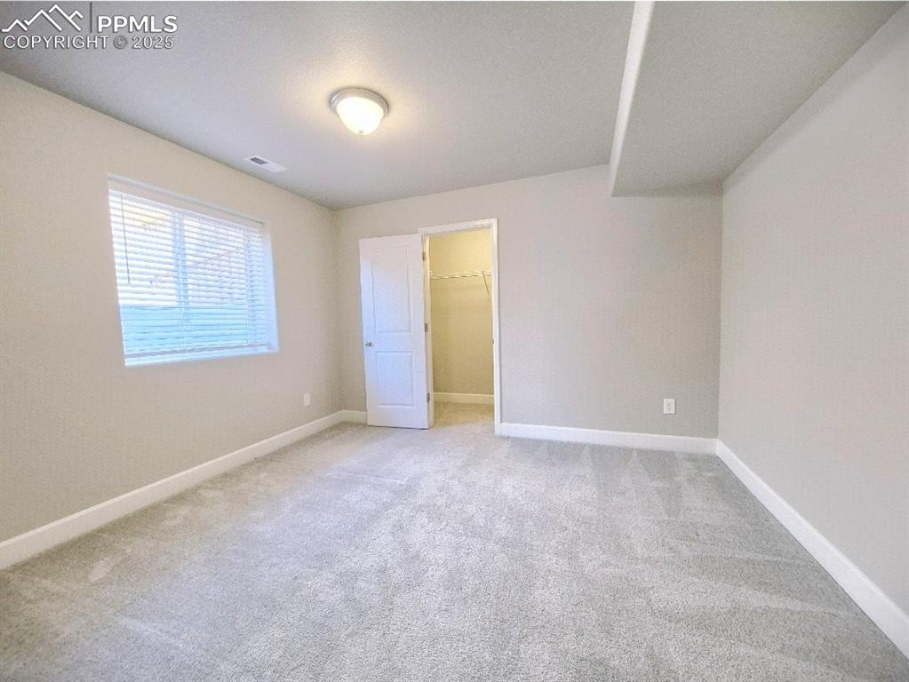 Image 20 of 42: basement bedroom