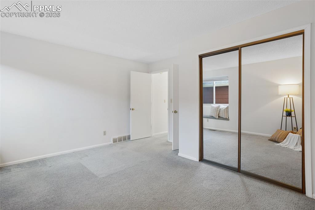 Image 22 of 31: Bedroom featuring carpet floors and a closet