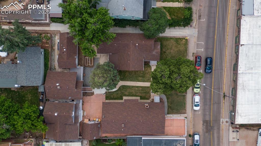 Image 4 of 48: Aerial view of the 6 units with parking lot across the street