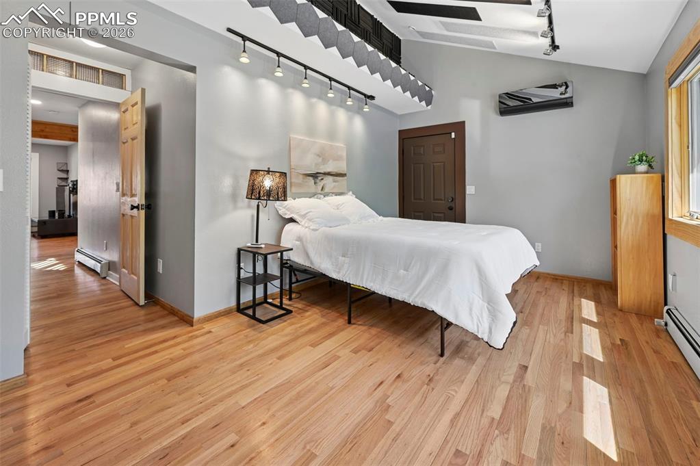 Image 15 of 40: large bedroom with access to backyard