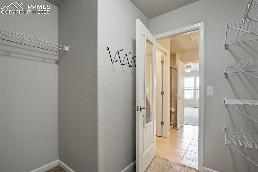 Image 24 of 45: Walk in pantry featuring tile patterned flooring