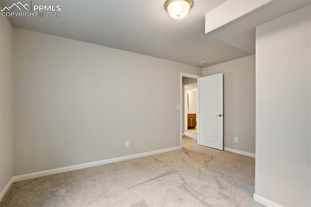 Image 30 of 45: Unfurnished room featuring carpet flooring and baseboards
