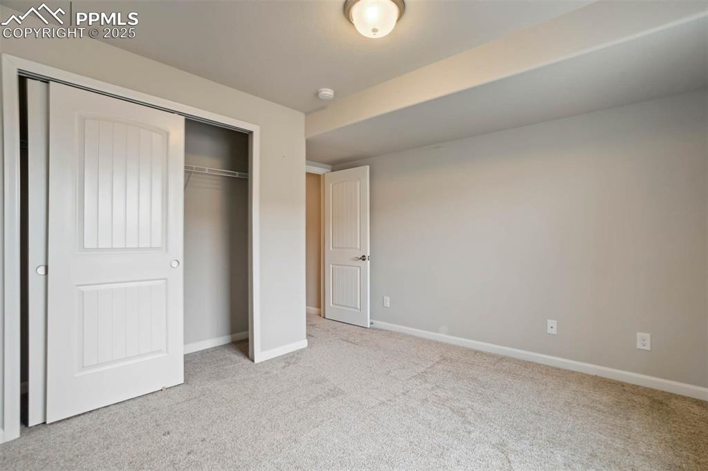 Image 37 of 45: Unfurnished bedroom with carpet floors and a closet