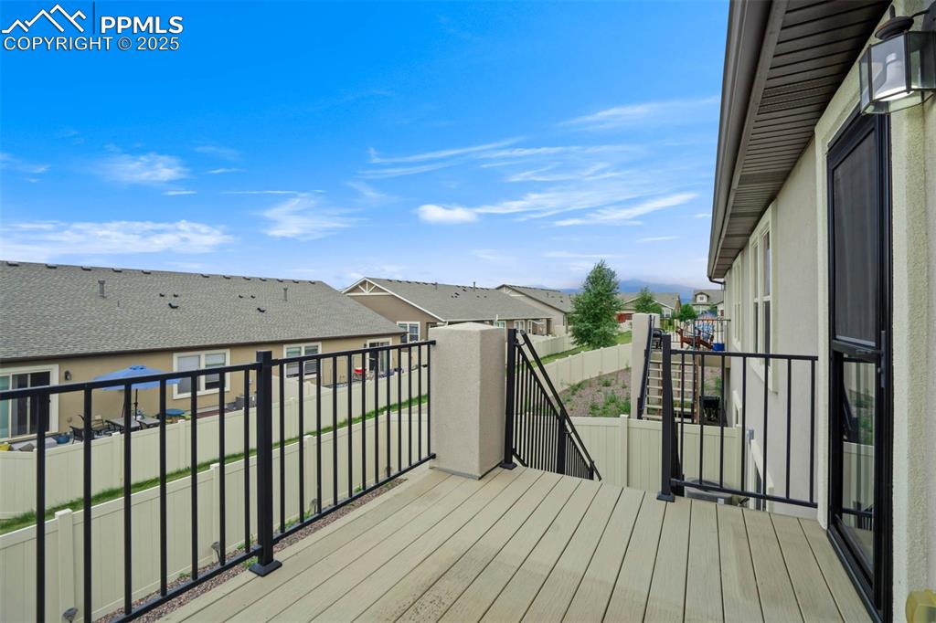 Image 40 of 45: Wooden terrace featuring a residential view
