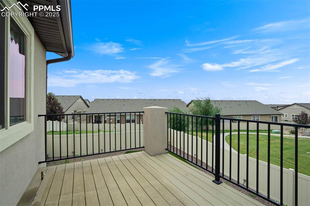 Image 41 of 45: Wooden deck with a residential view