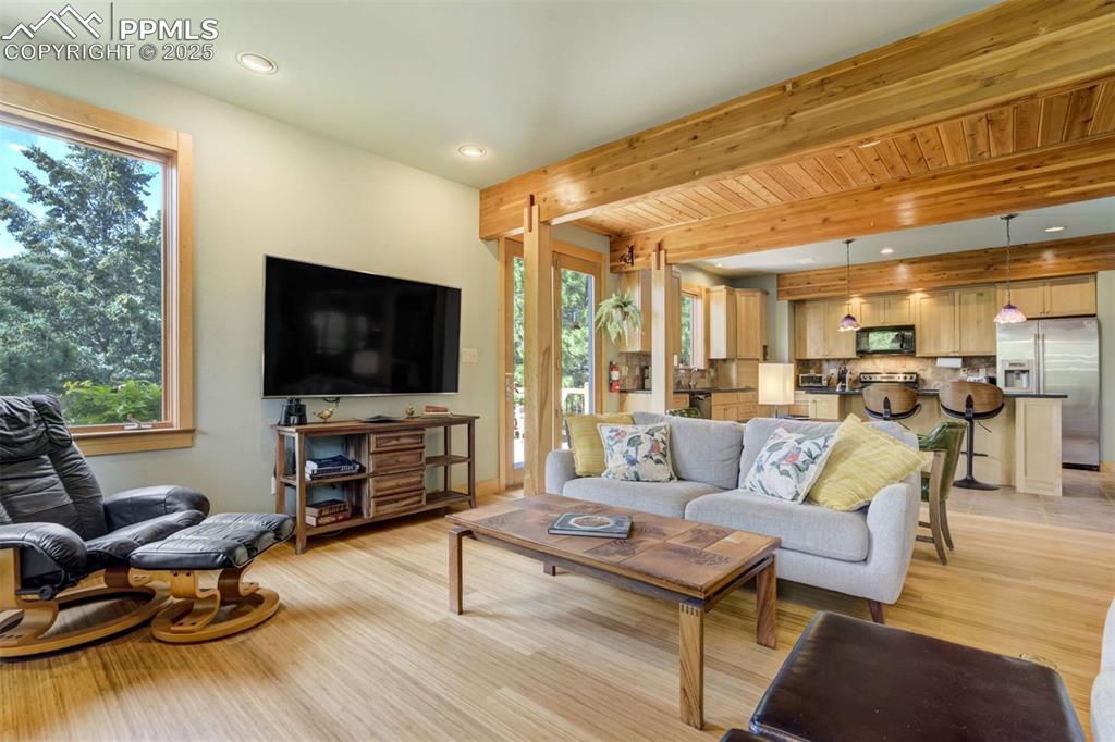 Image 13 of 50: Living area looking towards the kitchen. Open floor plan!