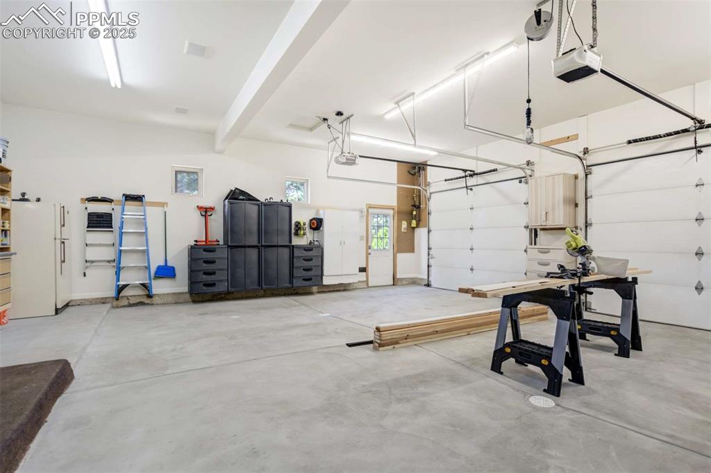 Image 40 of 50: Garage featuring newly poured floor, clean and organized and lots of room