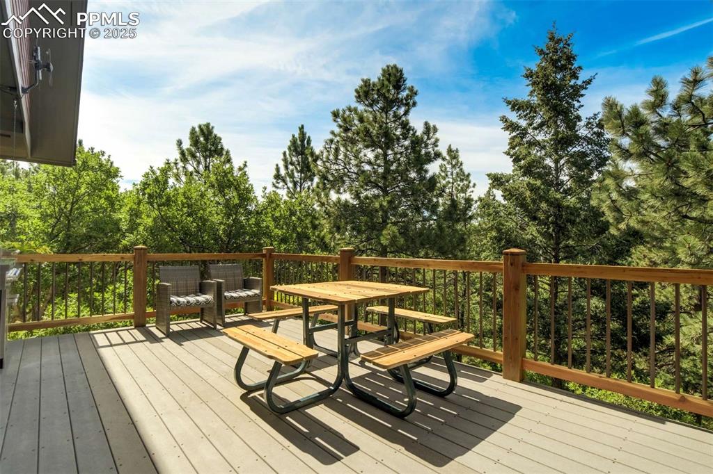 Image 42 of 50: Composite deck with outdoor dining area